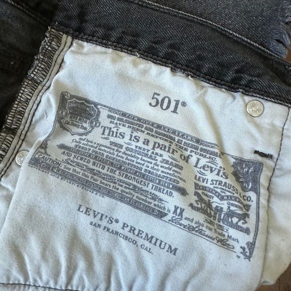 LEVI'S 501 High-Rise Cut-Off Raw Hem Jean Shorts in Washed Black - Picture 7 of 11